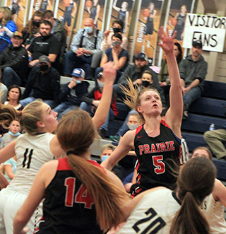 Ellea Uhlenkott puts up a shot at Grangeville. Also shown is Tara Schlader.