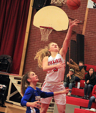 Kristin Wassmuth scores on a lay-up in the District second place game against Genesee on Saturday.