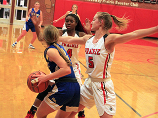 Madison Shears and Ellea Uhlenkott doubleteam the Genesee ballhandler in the District opener. Prairie held Genesee to just 7 second half points in the game.