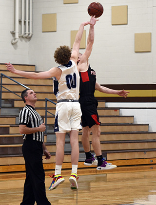 Cole Schlader won the opening tap from Riverstone’s 6’6” Charlie DeBoer. Photo by Shelley Schlader.