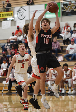 Zach Rambo goes for 2 of his 24 points against Oakley. Photo by Shelley Schlader.