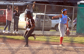 Madison Shears heads home with a grand slam homer.