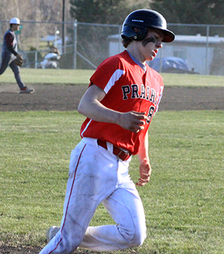 Connor Schwartz rounds third after hitting a game-ending 3-run homer against Kamiah.