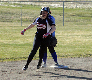 Mackenzie Key rounds second with a triple against Nezperce.