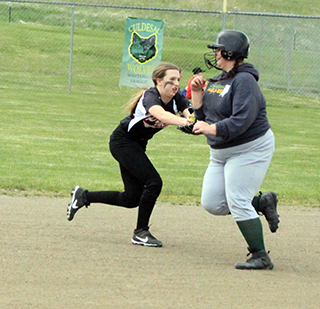 Second baseman Ember Martin tags out the runner after fielding a grounder in last Friday’s game against Culdesac.