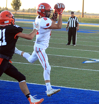 Wyatt Ross catches a touchdown pass as the clock runs out at the end of the second quarter.
