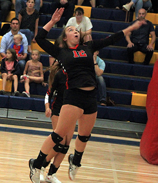 Josie Remacle goes up for a spike at Logos.
