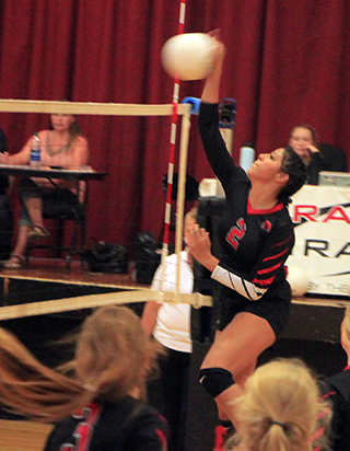 Trinity Martinez spikes the ball against Potlatch.