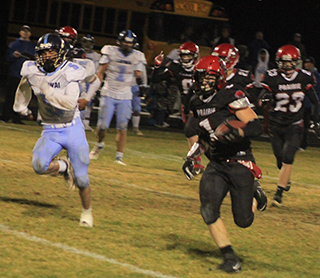 T.J. Hibbard on his way to Prairie’s only second half touchdown. Also shown are Noah Behler, Colton McElroy and Chase Kaschmitter.