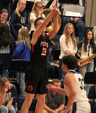 Lee Forsmann shoots for 3 at Grangeville. His 3-pointer with 4 seconds left was the margin of victory.