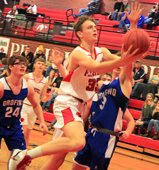 Lee Forsmann goes around an Orofino defender for a lay-up.