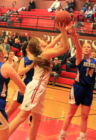 Tara Schlader goes for 2 of her 34 points against Genesee. Ali Rehder can be seen in the background.