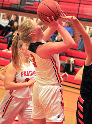 Kristin Wemhoff shoots against Kendrick. Also shown is Molly Johnson.