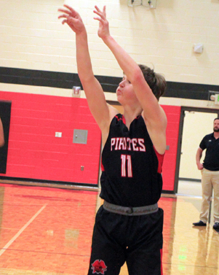 Lane Schumacher puts up a 3-point shot at Troy where he led all scorers with 21 points.