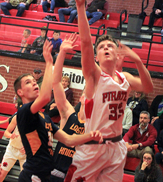 Lee Forsmann goes for a lay-up against Logos.