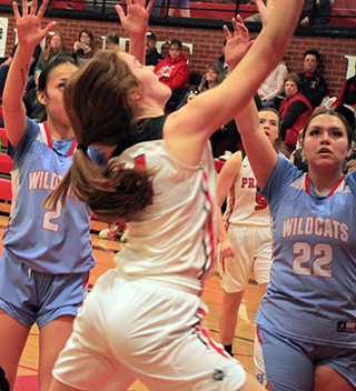 Tara Schlader goes for a lay-up against Lapwai. Delanie Lockett can be seen in the background. Schlader was one of 3 players with a double-double in points and rebounds against Lapwai. Kristin Wemhoff and Laney Forsmann were the others.