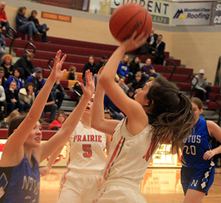 Ali Rehder puts up a shot against Notus. She wound up as Prairie’s 2nd leading scorer at State. Also shown is Delanie Lockett.