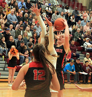 Kristin Wemhoff puts up a shot against Butte County. Also shown is Josie Remacle who had 14 points and 11 rebounds in tha game.