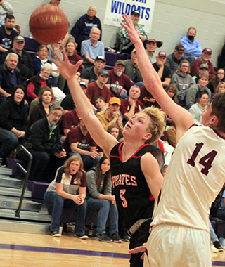 Kyle Schwartz goes for a lay-up against Kamiah.