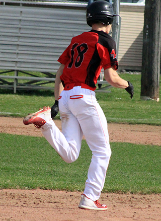 Colton McElroy pulls into second with the game-winning double against Troy at the Sourthfork Slugfest.