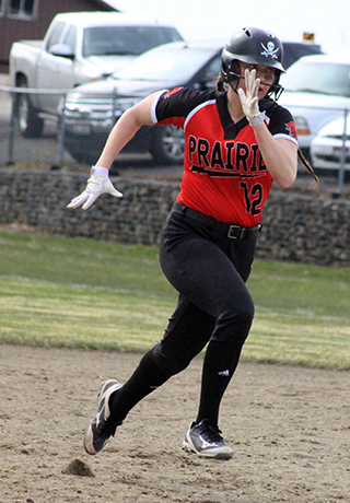 Josie Remacle heads for third with a triple in the first game at Lewis County.