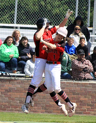 Noah Behler and Cody Kaschmitter celebrate after Cody scores the winning run against Rimrock.