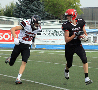 Ben Elven carries the ball after catching a pass early in the game.