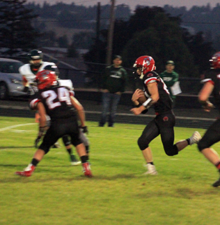 Colton McElroy returns a kickoff and once he got past the block made by Blake Bunce, #24, he was gone for a touchdown.