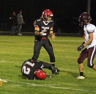 Shane Hanson recovers a Kamiah fumble. Also shown is Eli Hinds.