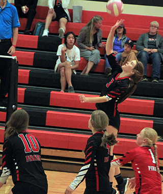 Tara Schlader goes up for a spike at Troy. Also shown are Kylie Schumacher, Lexi Schumacher and Kristin Wemhoff.