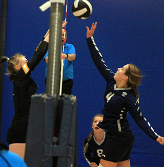 Sarah Waters jousts at the net with a Timberline player at District.