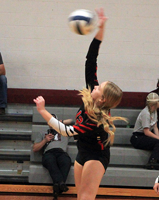 Taylor Riener spikes the ball against Grangeville.