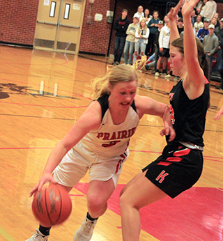 Kristin Uptmor drives towards the hoop against Kendrick.