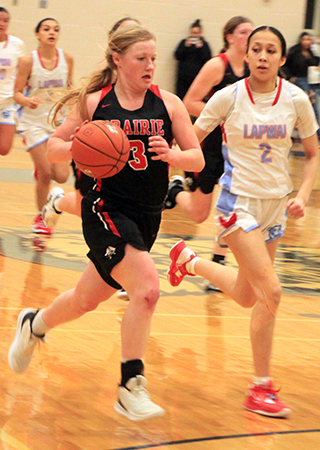 Kristin Wemhoff drives toward the ball down the floor. Also shown is Kylie Schumacher.