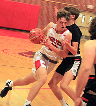 Lee Forsmann drives into the lane against Troy.