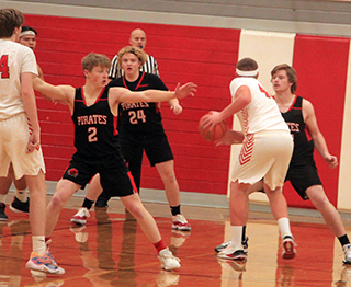 Matt Wemhoff, Noah Behler and Shane Hanson play defense at C.V.