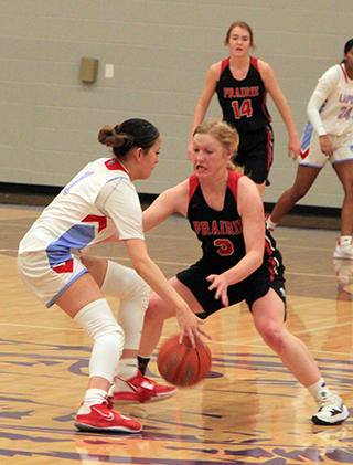 Kristin Wemhoff plays defense against Lapwai. Also shown is Tara Schlader.