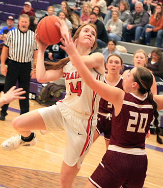 Tara Schlader puts up a shot against Kamiah in the second place game at District.