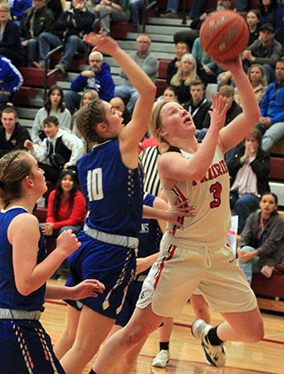 Kristin Wemhoff goes for a lay-up against Raft River.