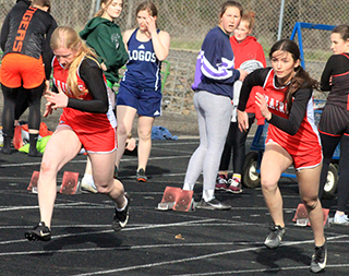 Kristin Wemhoff and Julia Rehder get out of the blocks at the start of the 100 meter dash at Lapwai last Tuesday. They finished 1st and 3rd respectively.