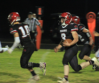 Chris Schumacher blocks for Dylan Uhlenkott. Uhlenkott had 347 yards and 3 touchdowns in the game.