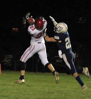 Bennie Elven makes an over the shoulder catch for a second quarter touchdown at Logos.
