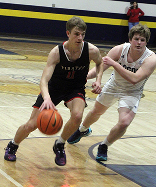 Briggs Rambo drives past a Logos defender.