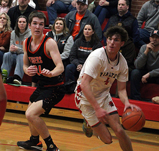 Riley Shears drives the baseline for a lay-up against Kendrick.