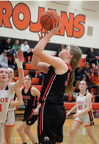 Sage Elven shoots at Troy. Also shown is Aubree Rehder.