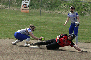 Avery Schacher slides into second against Genesee.