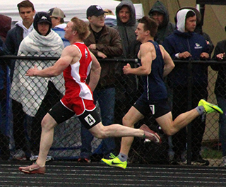 Dylan Uhlenkott makes up the stagger by halfway down the backstretch in the 400, one of his 4 first place medals.