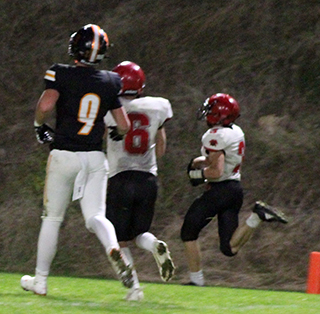 Cooper Riener crosses the goal line with Prairie’s only touchdown at Kendrick. Also shown is Payton Stamper.