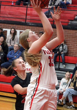 Sage Elven goes for a lay-up against Moscow.