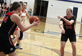 Sage Elven passes to Kylie Schumacher in the game against Grace.